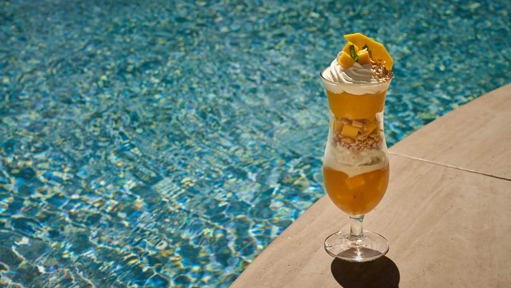 Cocktail by the pool at Seafire Grand Cayman