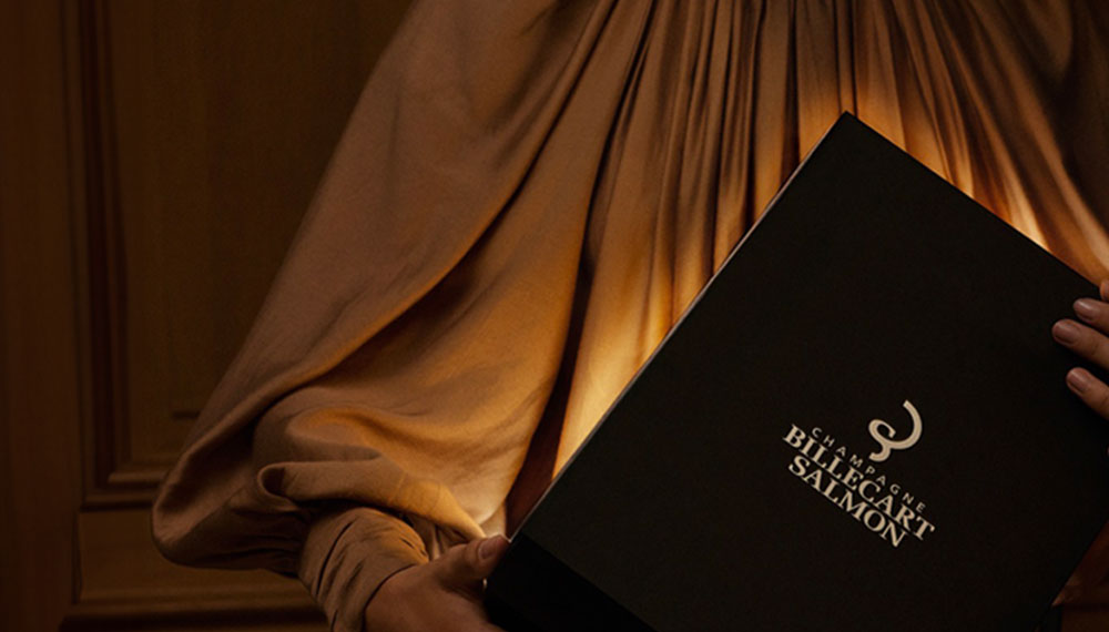 woman holding billecart salmon menu