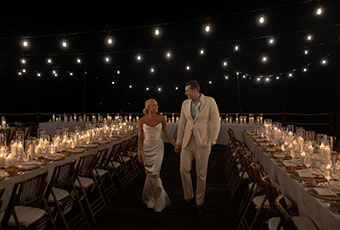 Couple among reception tables at Kimpton seafire